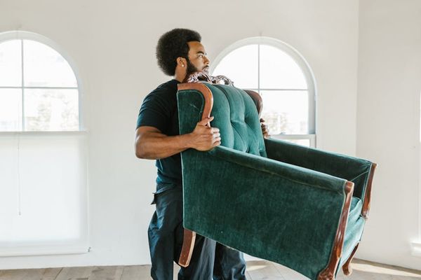 A person moving gracefully in a bright, spacious room.